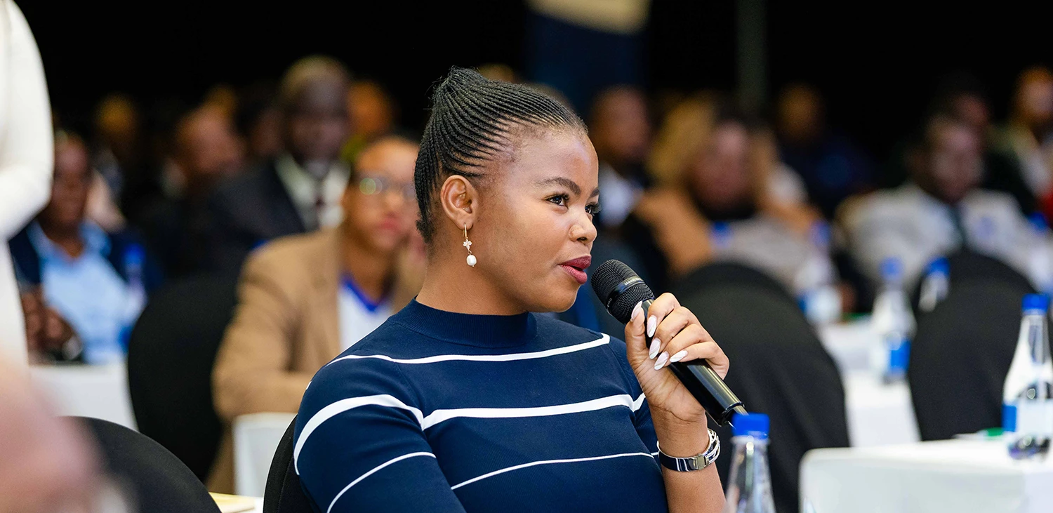 Charity Moyo at conference